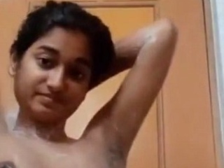 Nude Indian teen takes a bathroom selfie